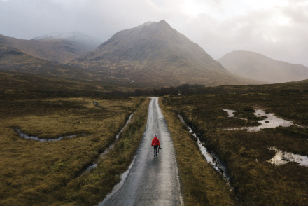 woman-walking-road-glen-etive-scotland